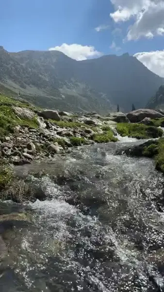 A stream flowing through a mountain valley