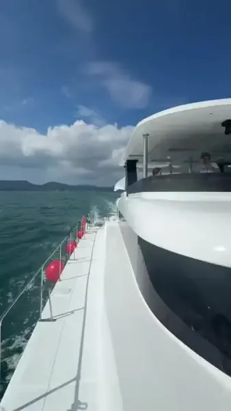 A boat travelling over blue water