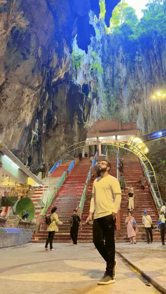 Ameer on colourful steps inside a cave