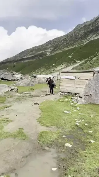 A mountain landscape viewed from a moving vehicle